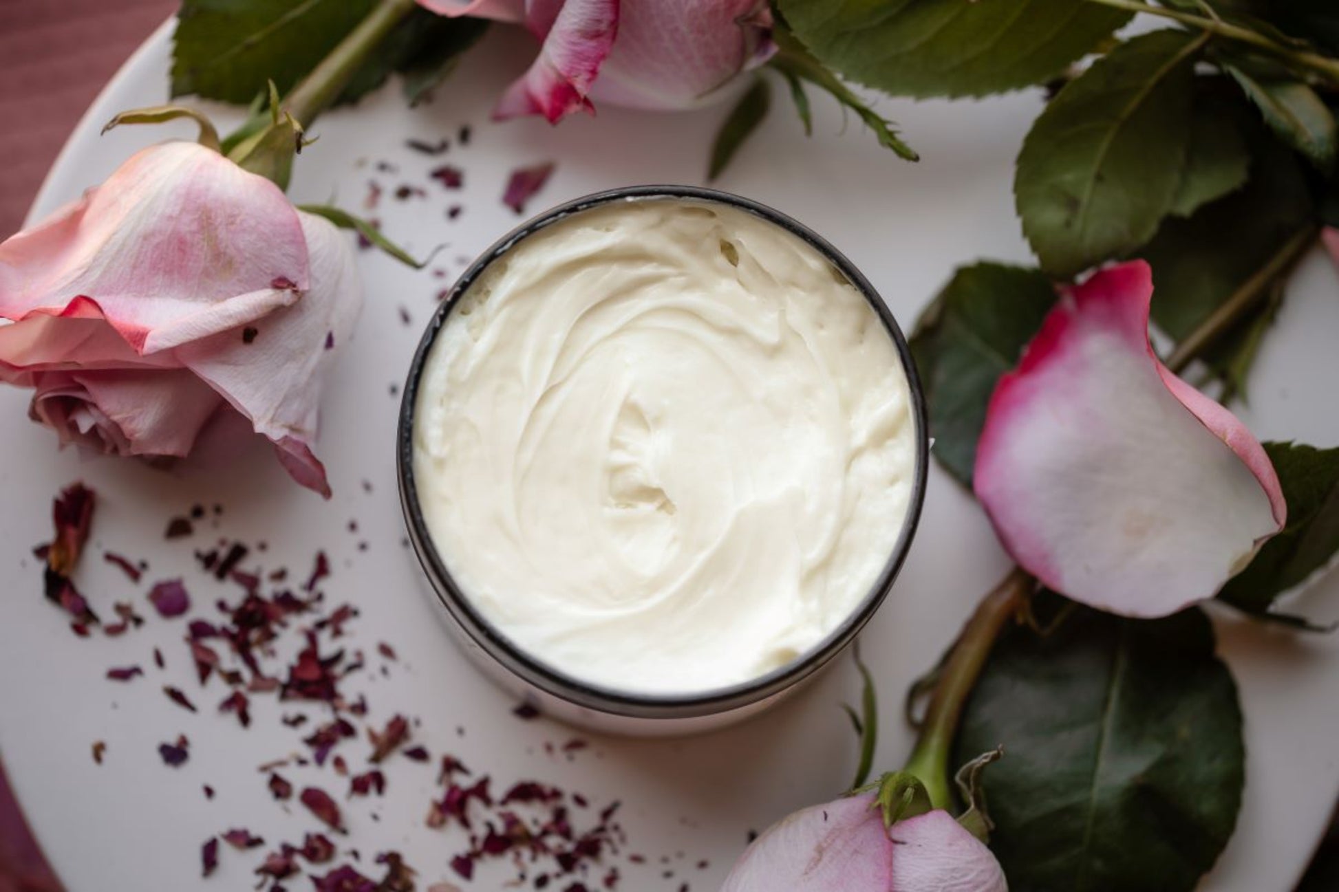 All natural, handamade whipped body butter scented with rose, top view. 